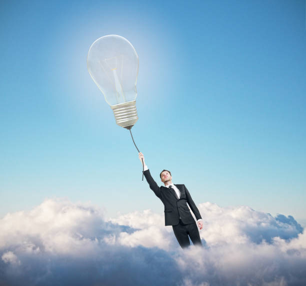 Businessman flying with lamp