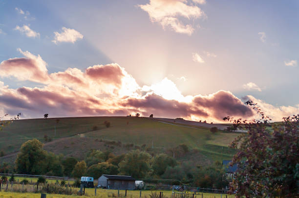 istock The sun setting over the fields of beautiful Wiltshire 1163934399