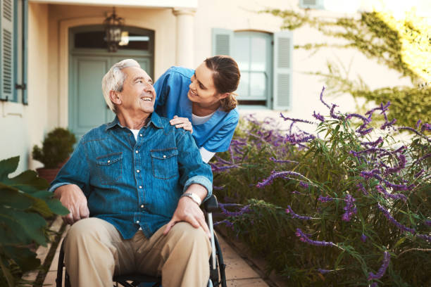 I hope you know how much you're valued Cropped shot of a young female nurse outside with a senior patient in a wheelchair old building stock pictures, royalty-free photos & images