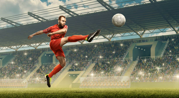 istock Soccer player kicking ball. Soccer stadium 1163936532