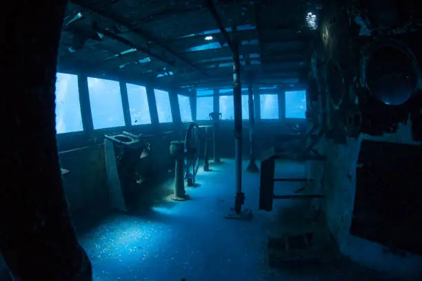 The USS Kittiwake, one of the best-known wreck dives in the Caribbean Sea, now lies empty. The 251-foot long ship was sunk off the coast of Grand Cayman in 2011 in order to create an artificial reef.