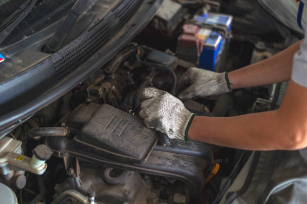 istock mechanic working car maintenance with soft-focus and over light in the background 1163939918