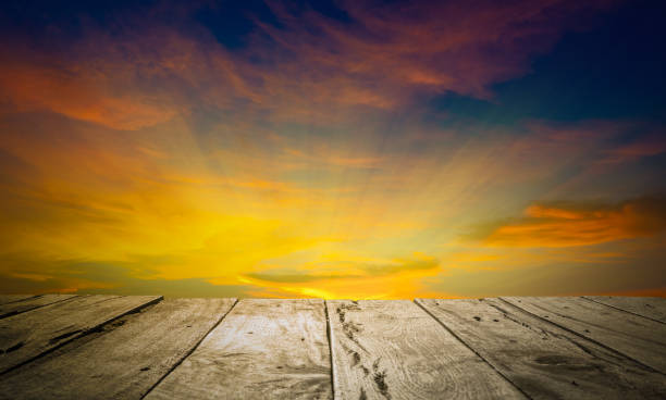 istock Old brown wooden floor and sky background in evening and beam sunset. Using idea design wallpaper concept natural, display backdrop for product. 1163941031