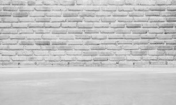 istock blank white floor cement and brick wall texture background for using idea design wallpaper or display backdrop for product. 1163941578