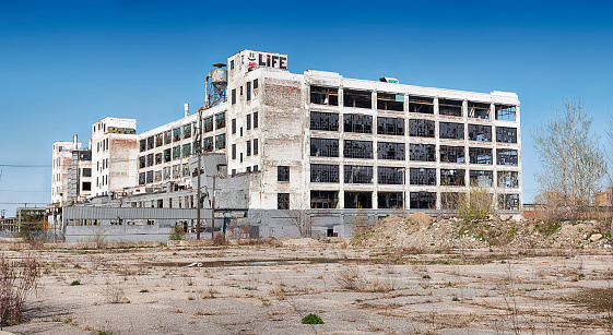 Detroit, Michigan - April 28, 2019:  A panorama view of the old Fisher Body Works factory in Detroit as seen from one of the old parking lots that surround the building.