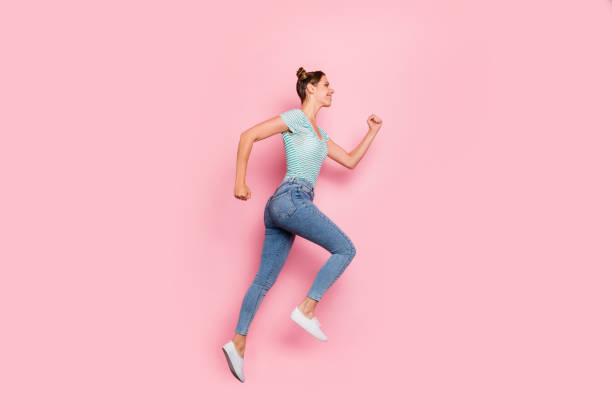 istock Full length body size profile side view of her she nice-looking lovely charming cute slender graceful strong purposeful cheerful cheery girl running isolated over pink pastel background 1163954251