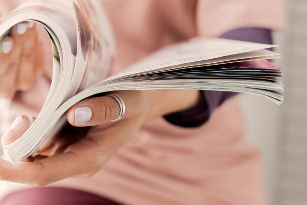 istock Young woman with a booklet with blank pages 1163955950