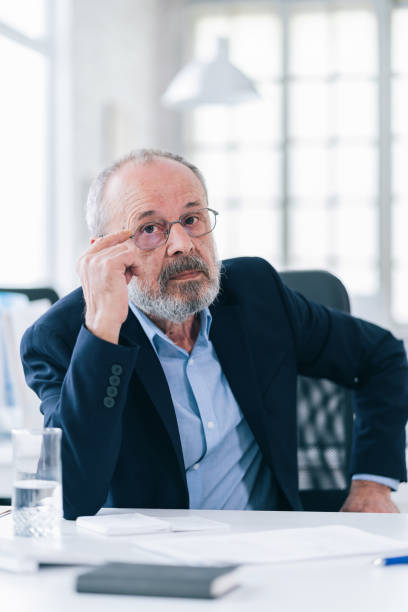 istock A senior businessman working in his modern office 1163956157