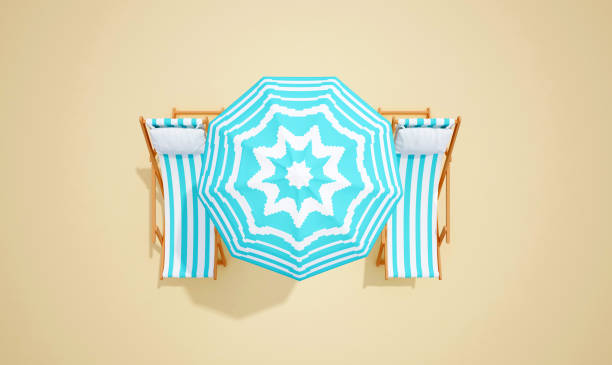 istock lounger with an umbrella on sand color top view 1163956456