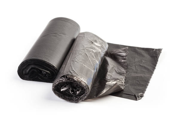 istock roll of plastic garbage bags isolated on white background 1163956674