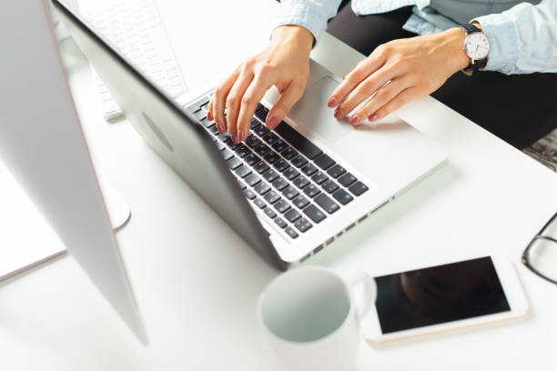 istock businesswoman working at her office 1163957929