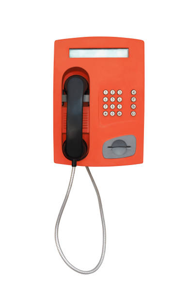 赤いヴィンテージの公衆電話孤立 - coin operated pay phone telephone communication ストックフォトと画像