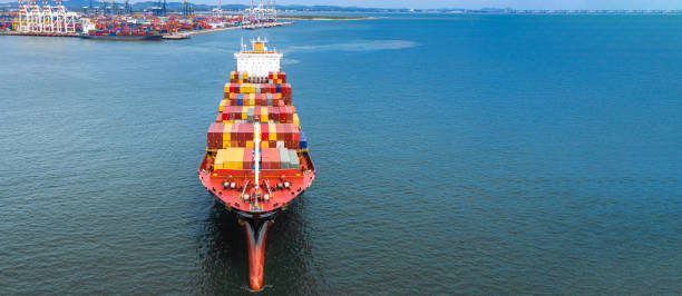 istock Aerial side view container ship carrying container in import export business logistic and transportation of international by container ship in the open sea, with copy space. 1163959905