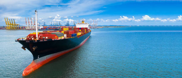 istock Aerial side view container ship carrying container in import export business logistic and transportation of international by container ship in the open sea, with copy space. 1163959965