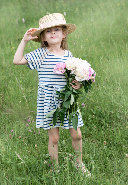 istock Cute little girl in a field 1163959980