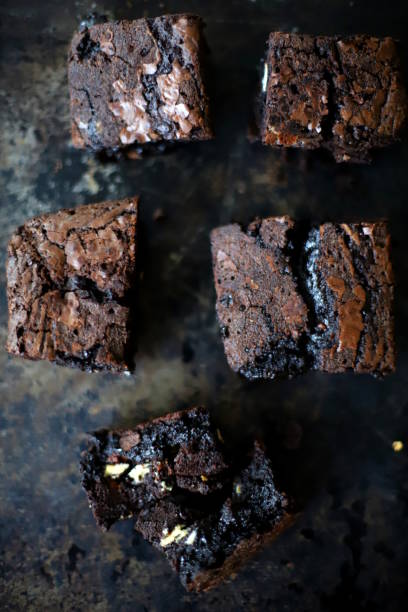 istock Gooey chocolate chunk brownies on a baking tray 1163961360