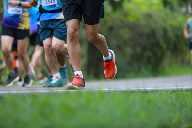 istock Group of people running race marathon 1163961638