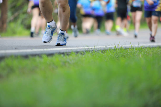 istock Group of people running race marathon 1163961639