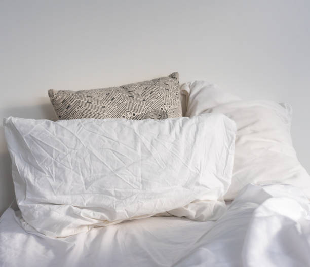 istock Blanket And Pillows On Bed At Home 1163961671