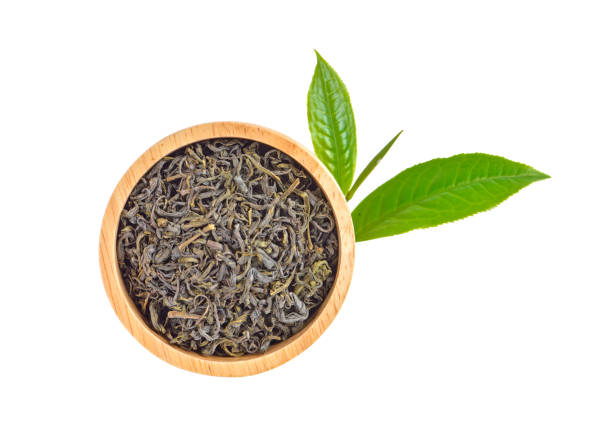 istock Fresh and dried green tea leaves  on white background 1163962315