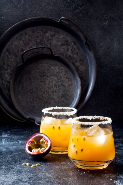 istock Mango passionfruit margarita cocktail with lime. Tropical alcoholic drink for summer party 1163963121