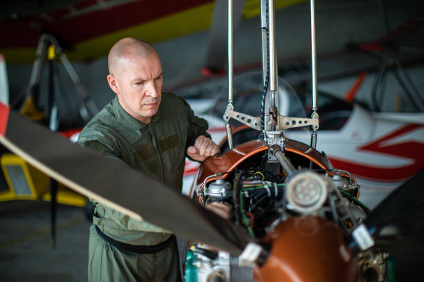 istock Aircraft mechanic inspecting and checking airplane 1163963848