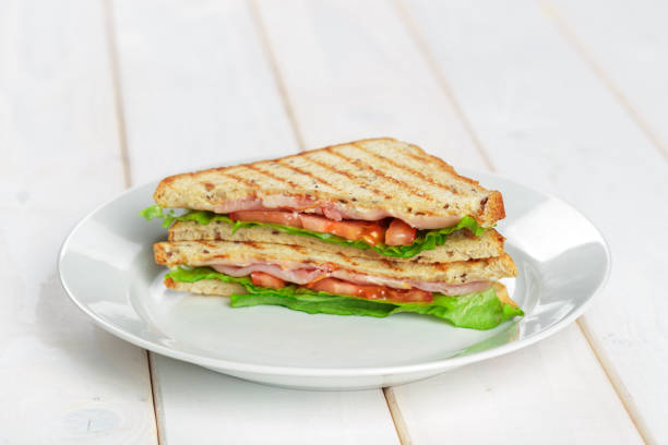 istock Club sandwich on wooden table 1163964450