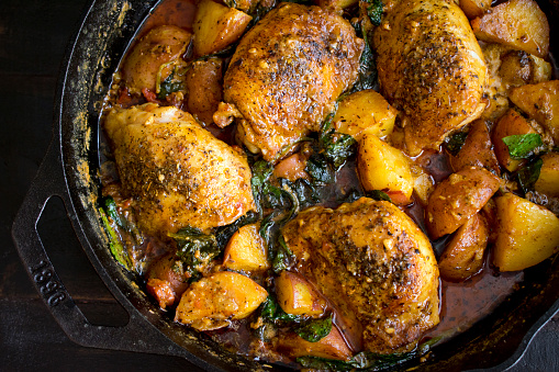 Chicken, potatoes, and spinach in parmesan cream sauce