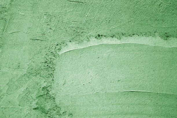 istock Grungy cement wall texture in green color. 1163965734