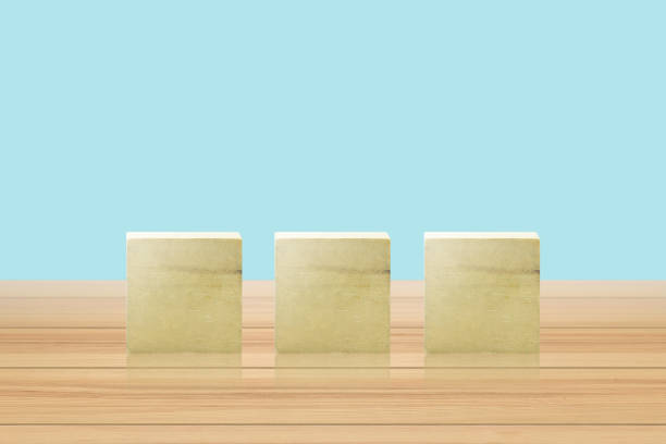 istock Wooden geometric shapes cube on arrange 1163966249