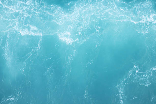 istock Sea Waves in ocean wave Splashing Ripple Water. Blue water background. Leave space to write messages. 1163966956