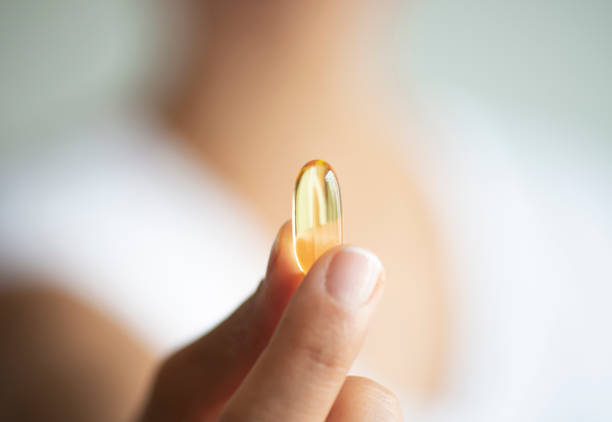 istock Woman with Soft Gel Capsule 1163967145