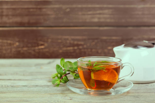 istock Cup of tea on wooden table 1163967610