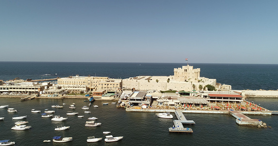 Aerial Drone shot over Egypt Alexandria City sea - The Citadel of Qaitbay
