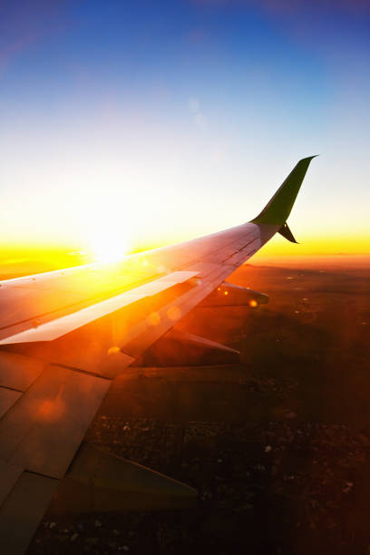 istock Wing of airliner over beautiful sunset 1163968536