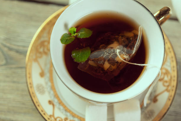 istock Cup of tea on wooden table 1163970673