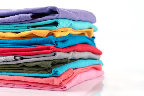 istock Stack of Colorful cotton T-shirt isolated on white background. 1163971485
