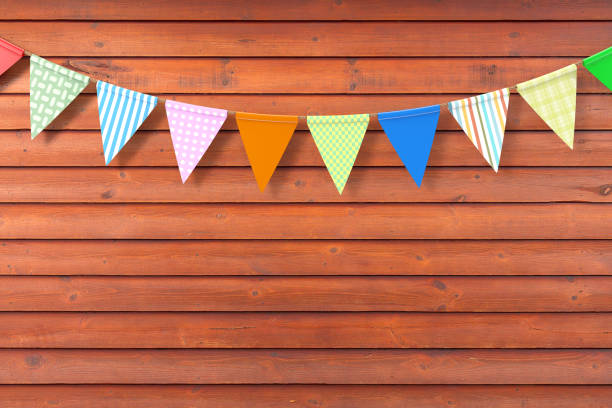 istock Colour Party Flags Hanging on a Red Wooden Plank Wall Background. 3d Rendering 1163971514