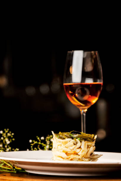 istock Beautiful cod dish with glass of wine. 1163971796