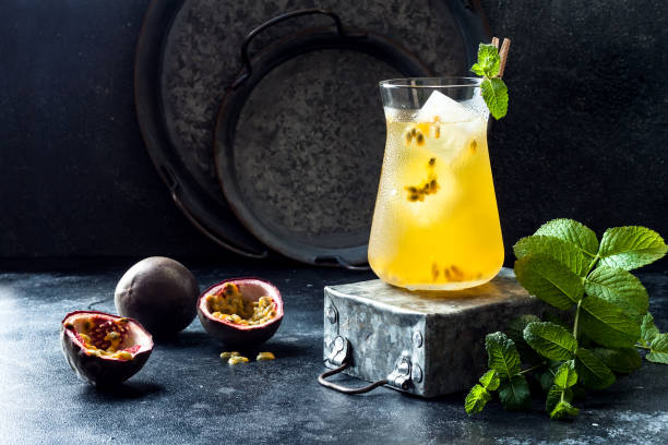 istock Passionfruit iced green tea or lemonade with lime and mint. Tropical refreshing cold drink for summer 1163972040