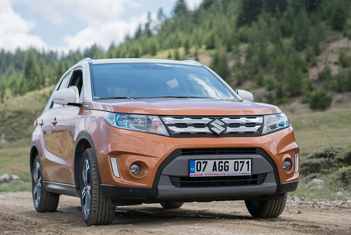 Antalya, Turkey - July 14, 2019: Suzuki Vitara stopped on the road during the test drive. The crossovers are very comfortable cars on the unmade roads. The new Vitara was debut in 2014. This car is one of the most popular SUV/crossover from Suzuki brand.