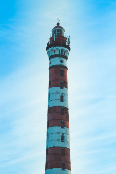 istock High lighthouse in the forest landscape. red and white lighthouse 1163975306