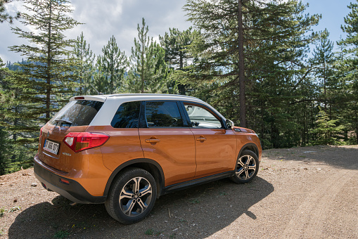 Antalya, Turkey - July 14, 2019: Suzuki Vitara stopped on the road during the test drive. The crossovers are very comfortable cars on the unmade roads. The new Vitara was debut in 2014. This car is one of the most popular SUV/crossover from Suzuki brand.
