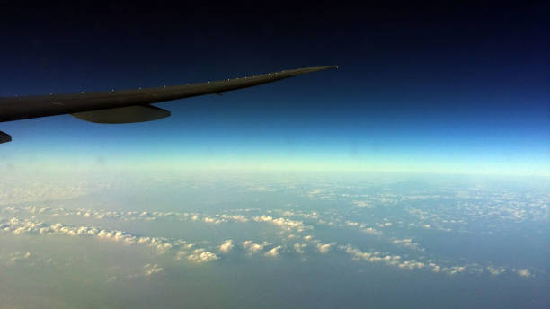 istock Ariplane wing with blue sky amazing view from plane window 1163976318