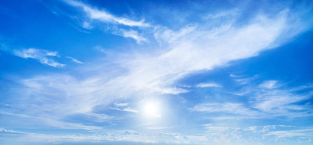 istock Majestic sun and clouds on blue sky 1163976523