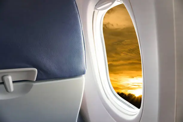 View From Airplane Window,view Sunset or azure sky and clouds from window of airplane