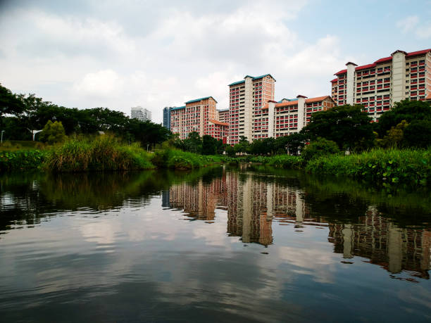 istock Residential area behind the park divided by a small river 1163977617