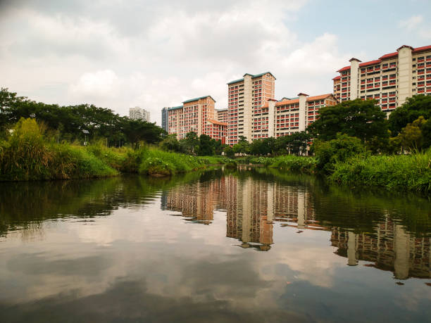 istock Residential area behind the park divided by a small river 1163977649