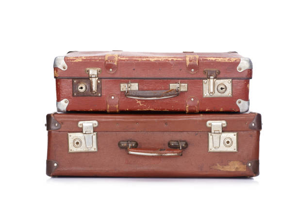 istock two vintage brown leather suitcases isolated on white 1163977901