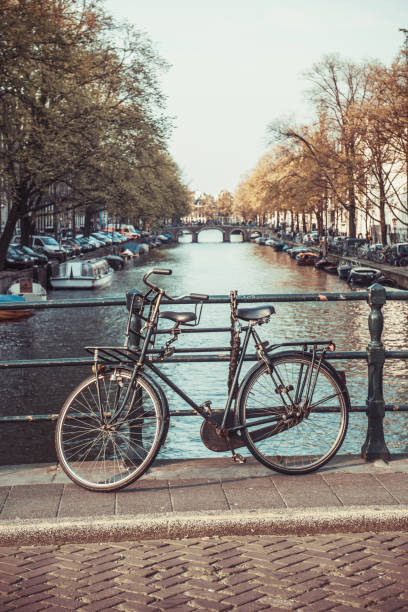 istock Canal Of Amsterdam And Parked Bicycle 1163980673